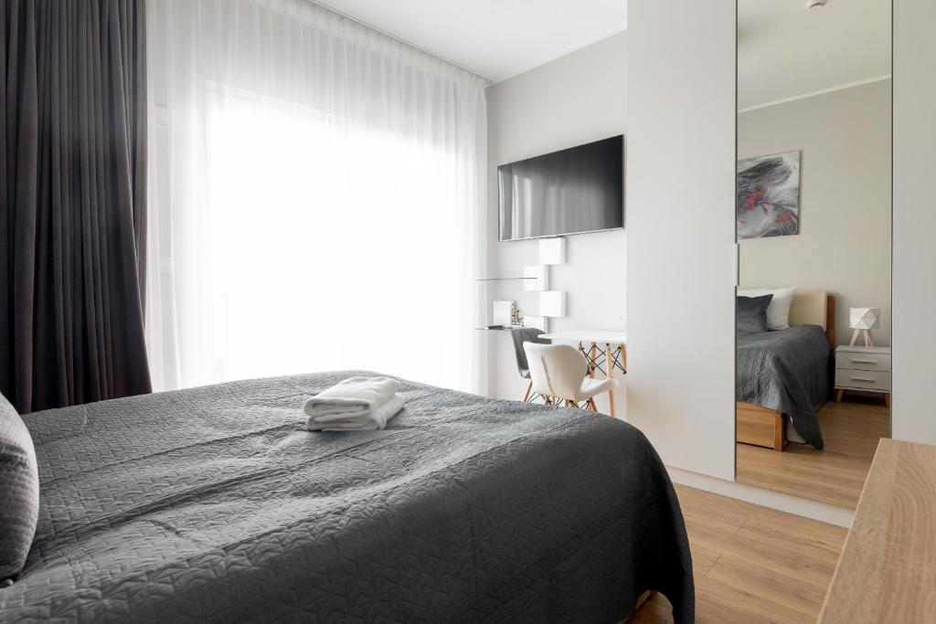 Posteľ alebo postele v izbe v ubytovaní Wola Chic Silver Studio