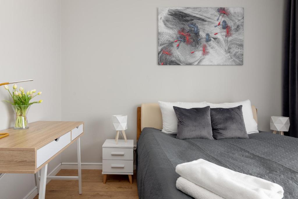 Posteľ alebo postele v izbe v ubytovaní Wola Chic Silver Studio