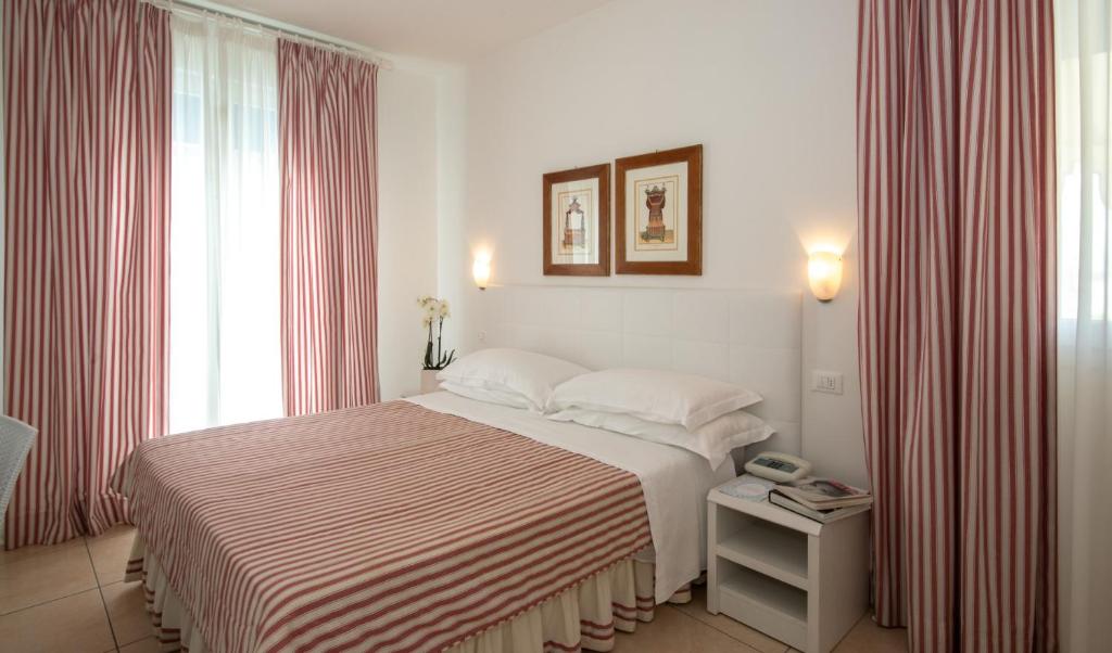 Postel nebo postele na pokoji v ubytování Hotel Plaza Esplanade