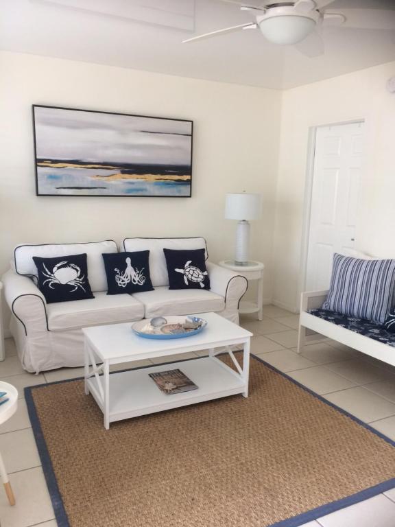 a living room with a couch and a coffee table at Gorgeous Beachy Chic Condo in Key Biscayne in Miami