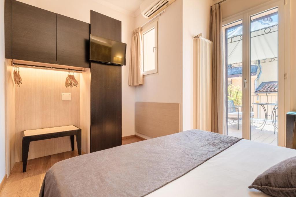 Postel nebo postele na pokoji v ubytování Hotel Touring
