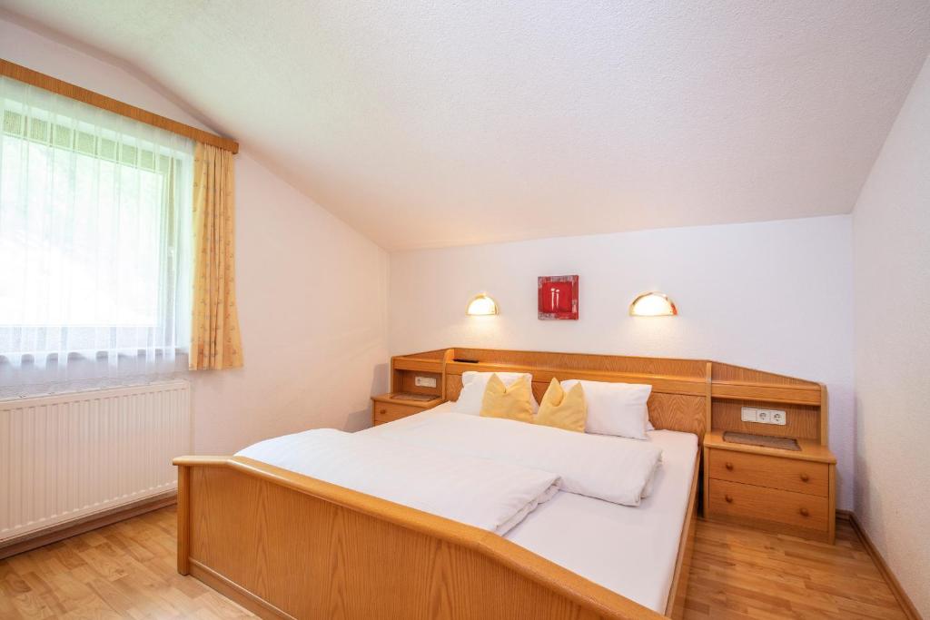 Posteľ alebo postele v izbe v ubytovaní Haus Hugo