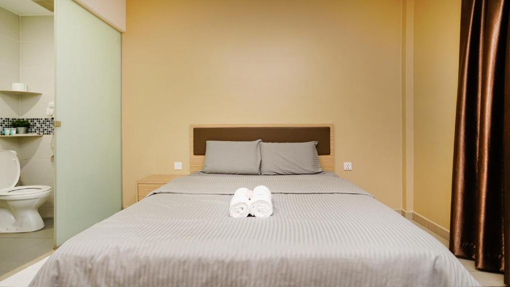 Postel nebo postele na pokoji v ubytování J.G. Resort