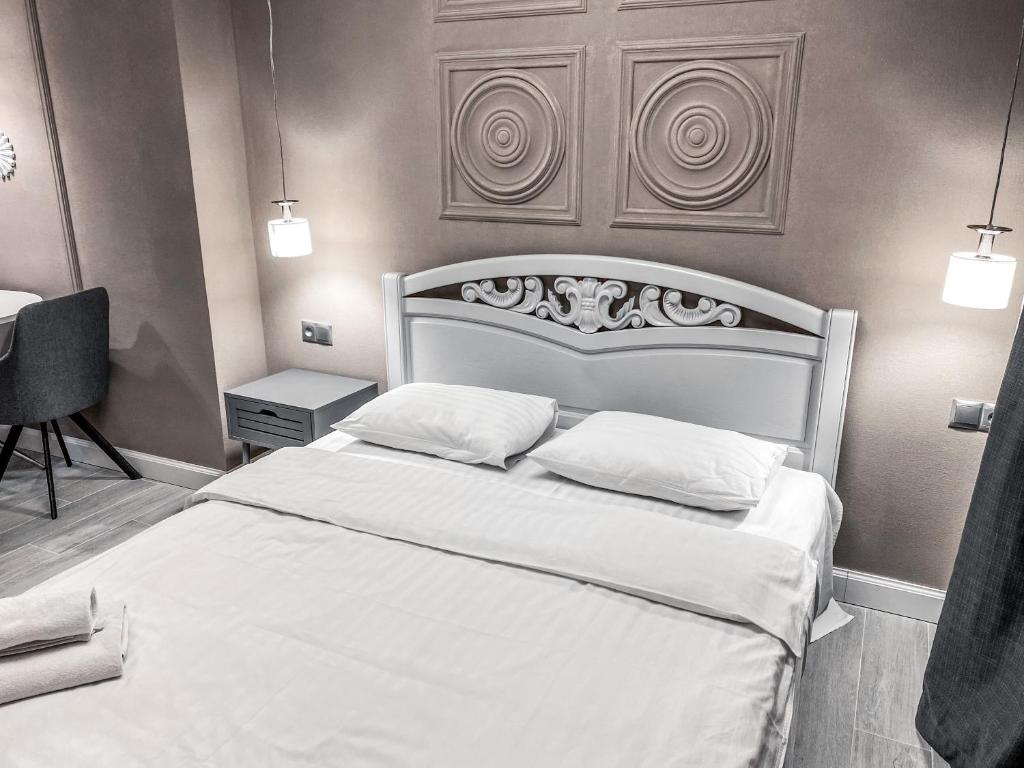 Letto o letti in una camera di Opera Center Hotel & Apartments