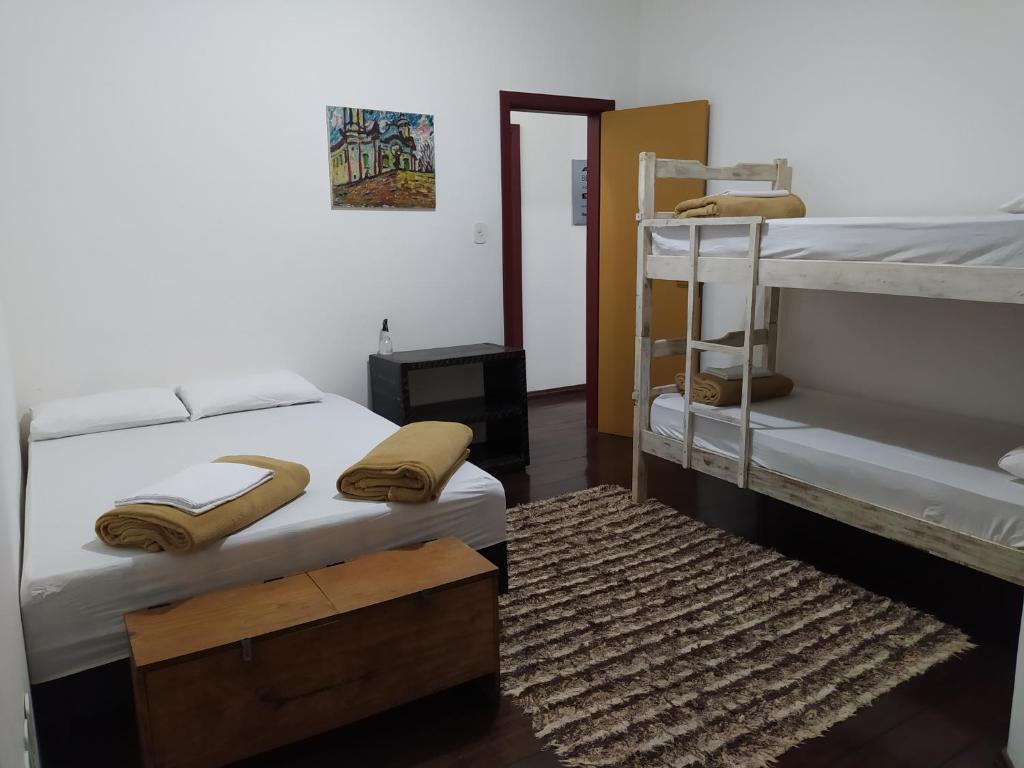 Postel nebo postele na pokoji v ubytování Trilhas de Minas Hostel Camping