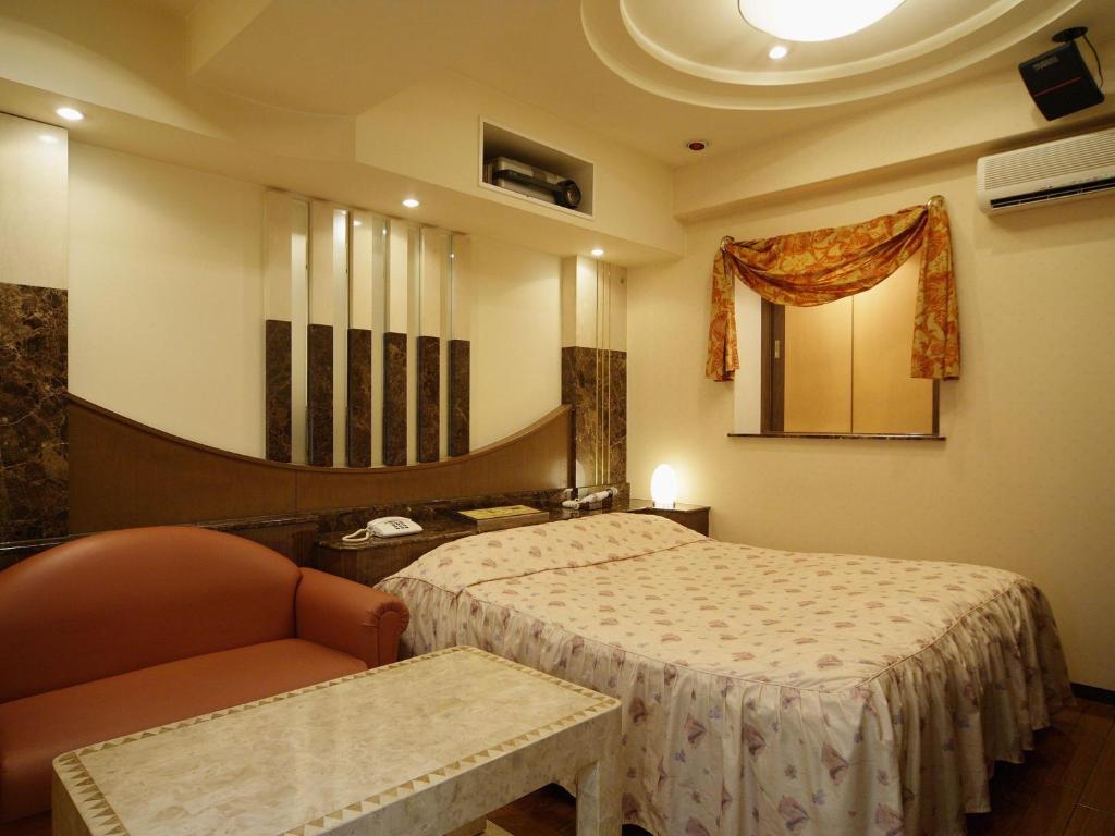 Postel nebo postele na pokoji v ubytování Hotel Fine Misaki