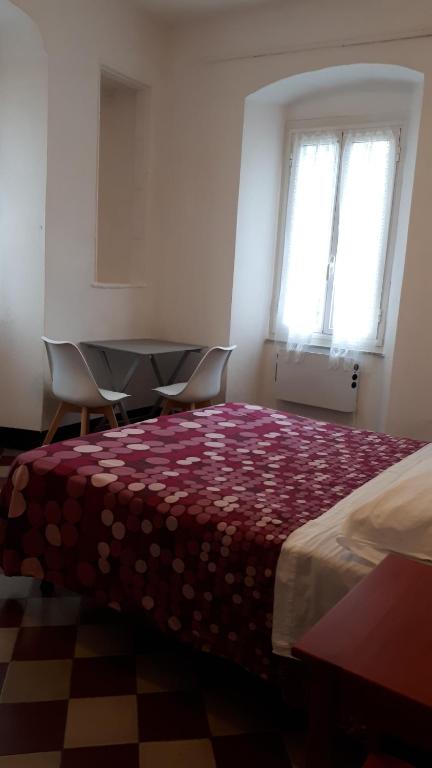Postel nebo postele na pokoji v ubytování La Ginestra