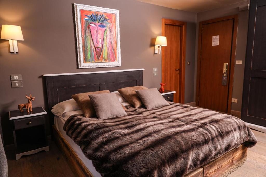 Postel nebo postele na pokoji v ubytování Art Hotel Grivola