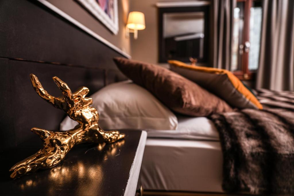 Postel nebo postele na pokoji v ubytování Art Hotel Grivola