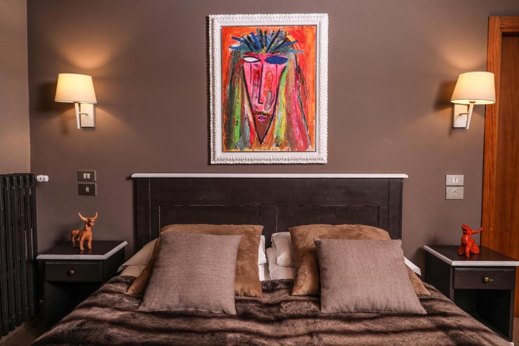 Postel nebo postele na pokoji v ubytování Art Hotel Grivola