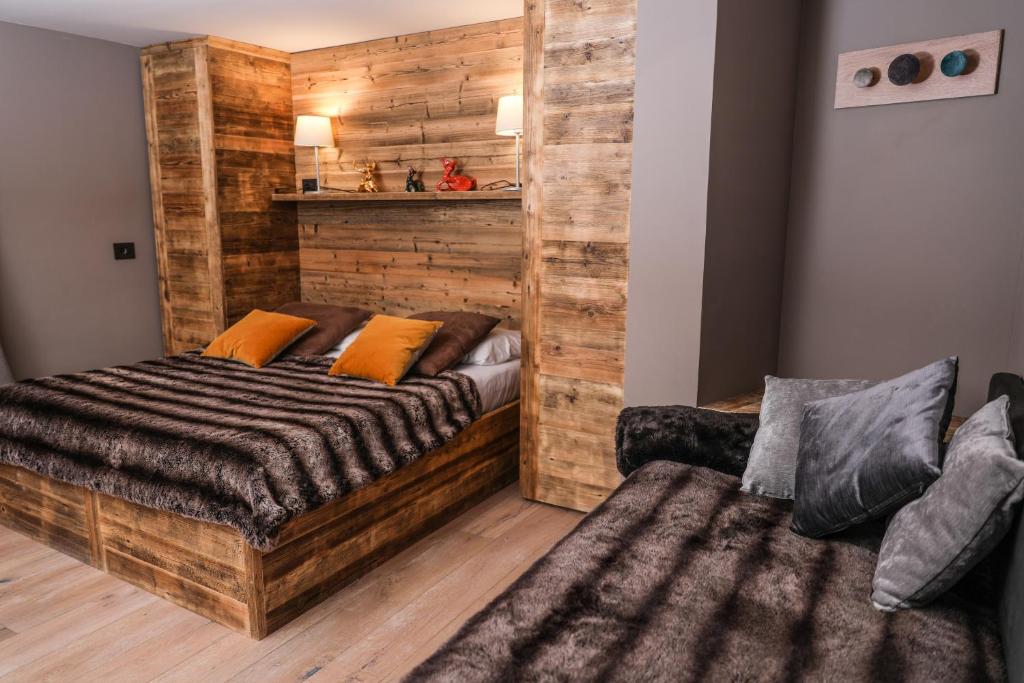 Postel nebo postele na pokoji v ubytování Art Hotel Grivola