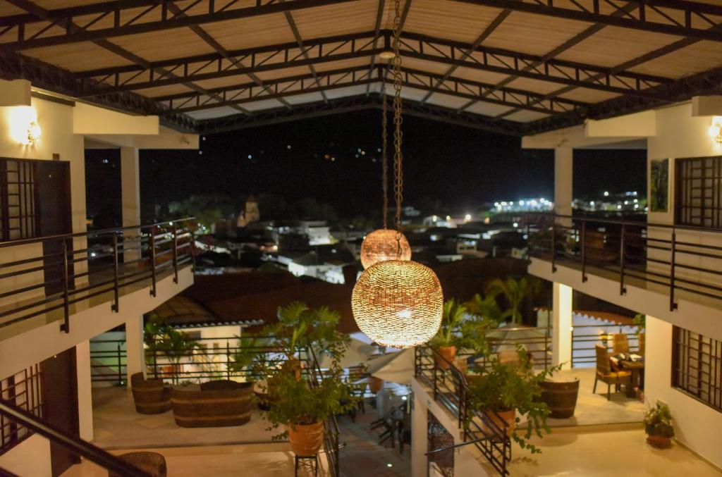 a large chandelier hanging from the ceiling of a building at Terrazas de San Agustin Hotel in San Agustín