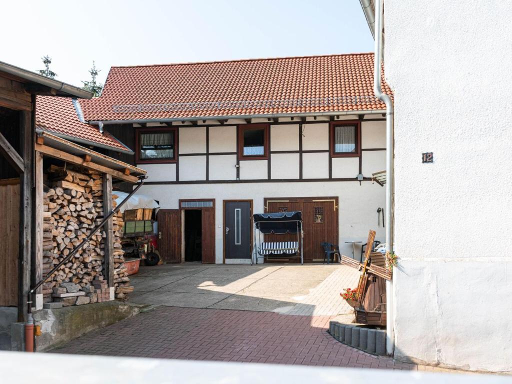 an outside view of a house with a patio at Scintillating Apartment in Wienrode near City Centre in Wienrode