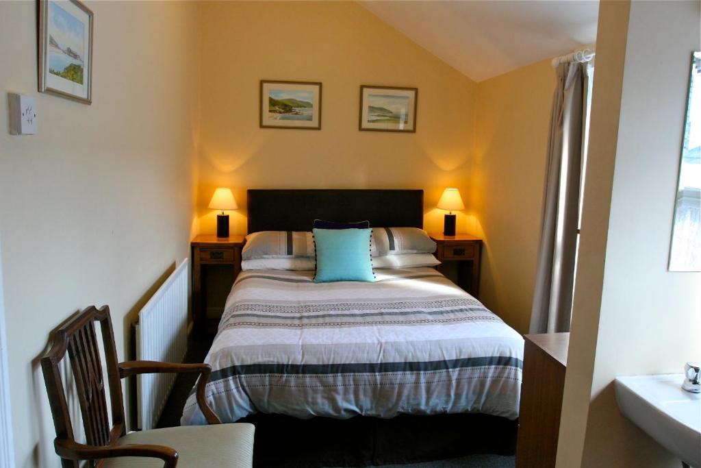 Кровать или кровати в номере Melrose Guest House