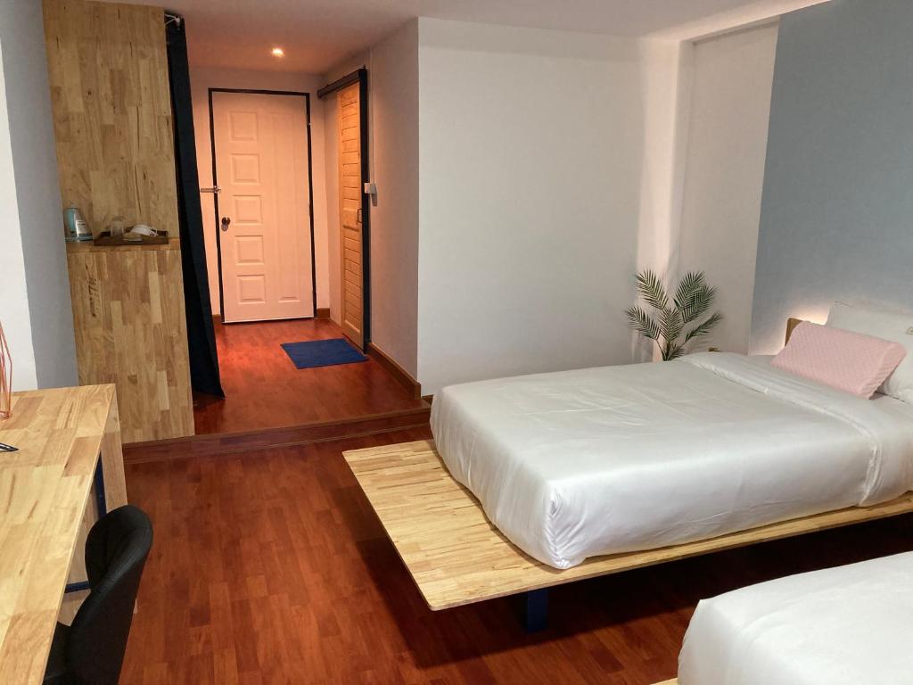 Postel nebo postele na pokoji v ubytování Moocoworking