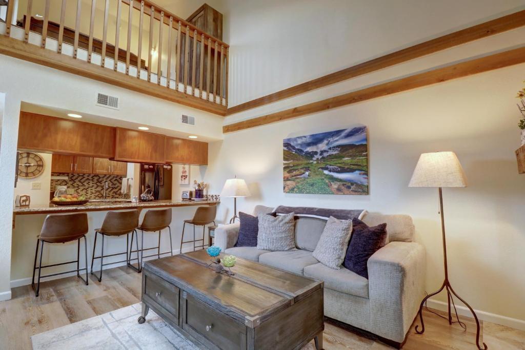 a living room with a couch and a table at 201C Mountain Side 1BR 1BA condo in Frisco