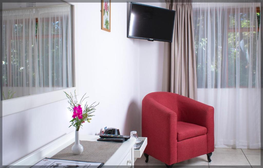 TV a/nebo společenská místnost v ubytování Andelomi Forest Lodge