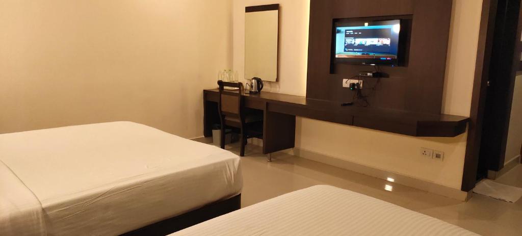 Postel nebo postele na pokoji v ubytování Hotel Deepam