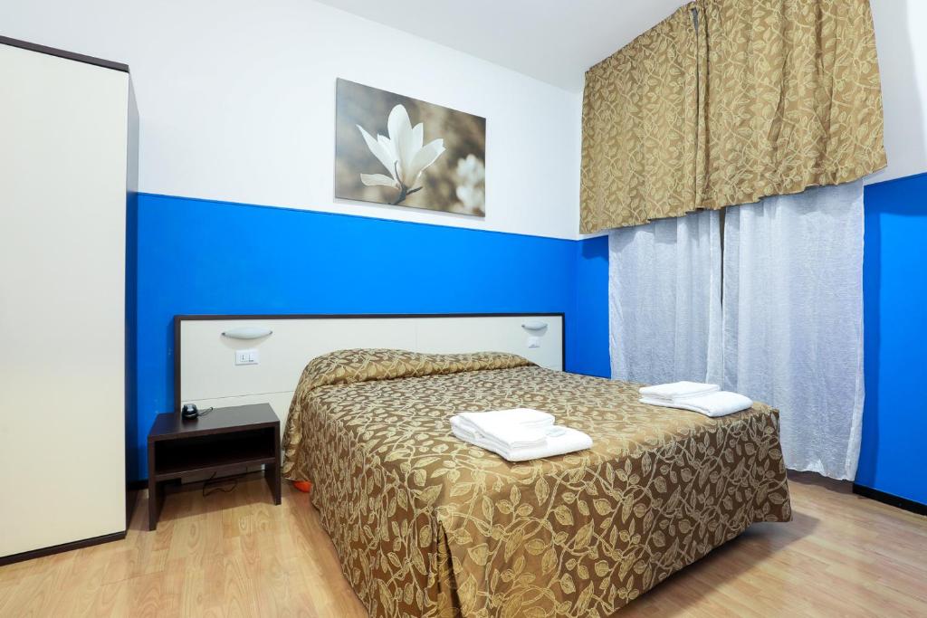 Postel nebo postele na pokoji v ubytování Mini Hotel