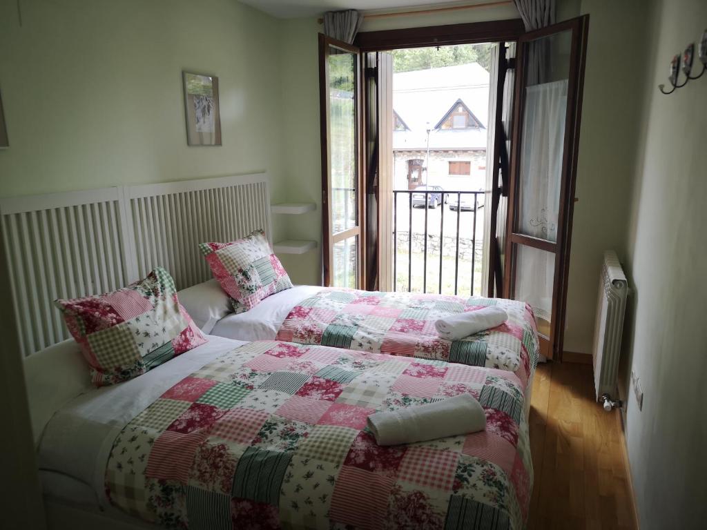 A bed or beds in a room at Apartamentos Aguas Limpias