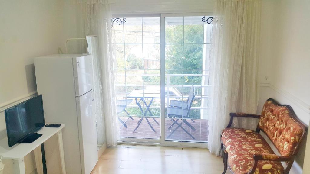 TV a/nebo společenská místnost v ubytování Bella Guesthouse
