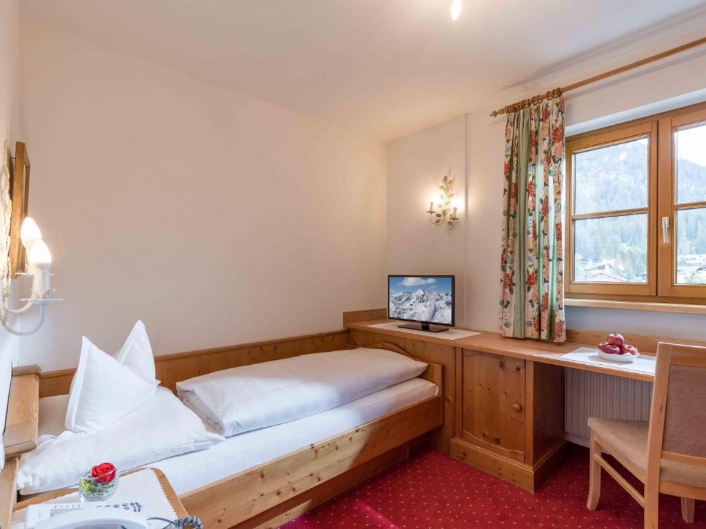 Postel nebo postele na pokoji v ubytování Hotel Antonius