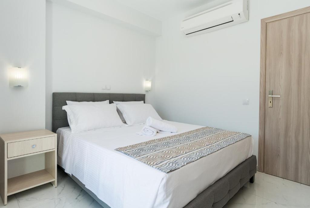 Postel nebo postele na pokoji v ubytování KIPOI APARTMENTS