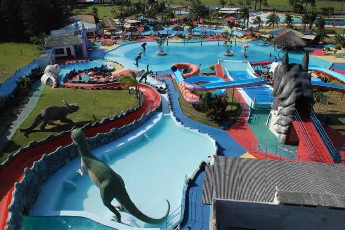 a large water park with a dinosaur park at Apto 2 quartos em Arroio do Silva in Arroio do Silva