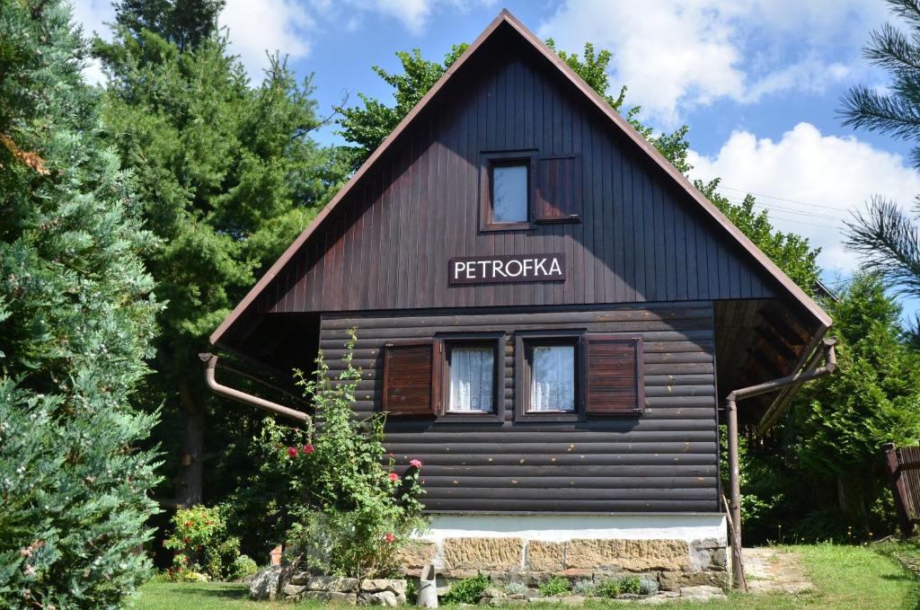 a wooden house with a sign that reads fredrikka at Chata Petrofka in Zdislava