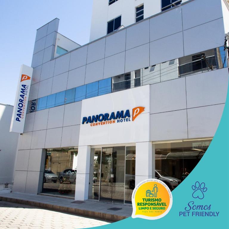 a building with a sign on the side of it at Panorama Convention Hotel in Coronel Fabriciano
