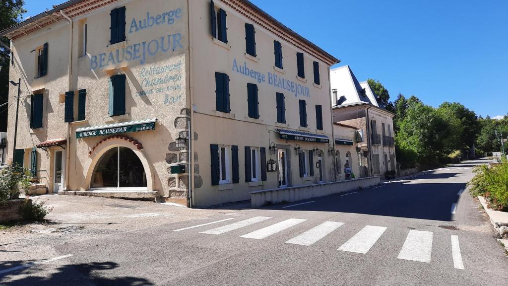 an empty street with a building on the side of the road at auberge beausejour in Concoules