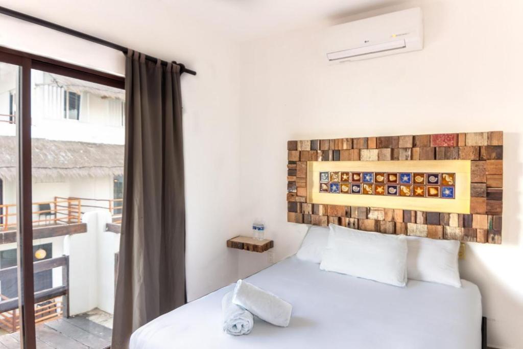 Postel nebo postele na pokoji v ubytování Hotel Blue Reef frente al mar