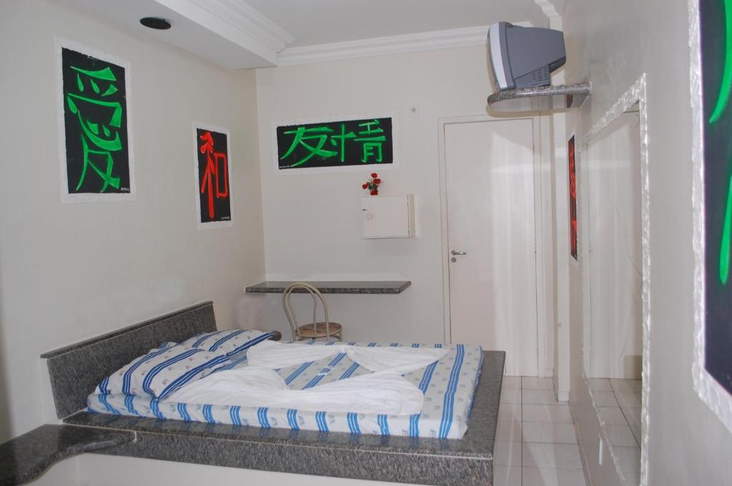 Postel nebo postele na pokoji v ubytování Hotel Piramide - Dois de Julho (Adult Only)