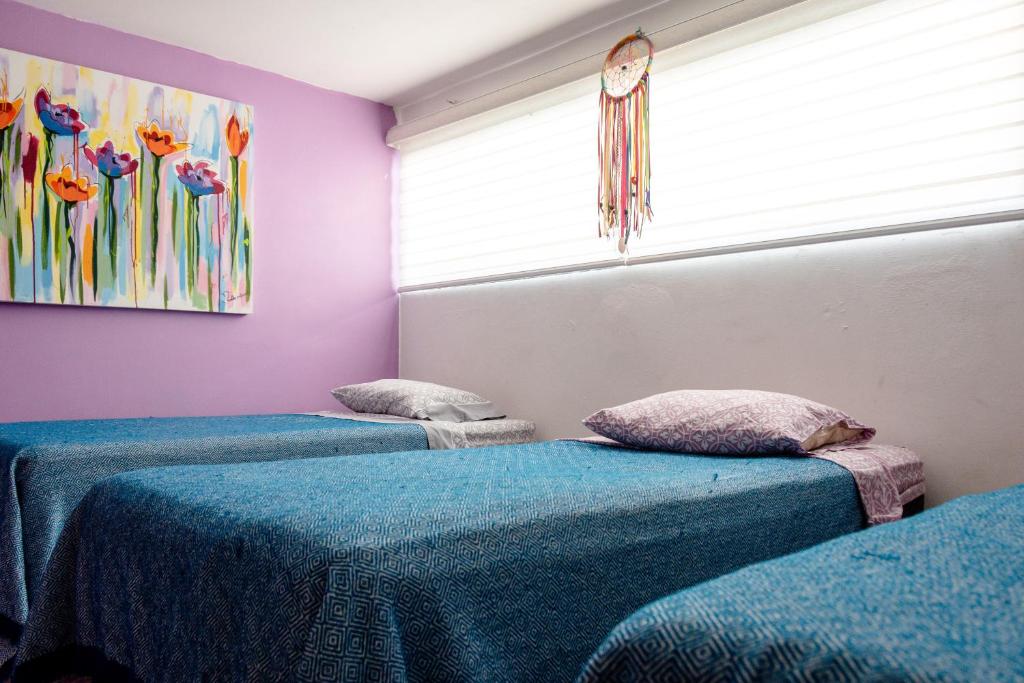 Postel nebo postele na pokoji v ubytování Hostel Vallarta