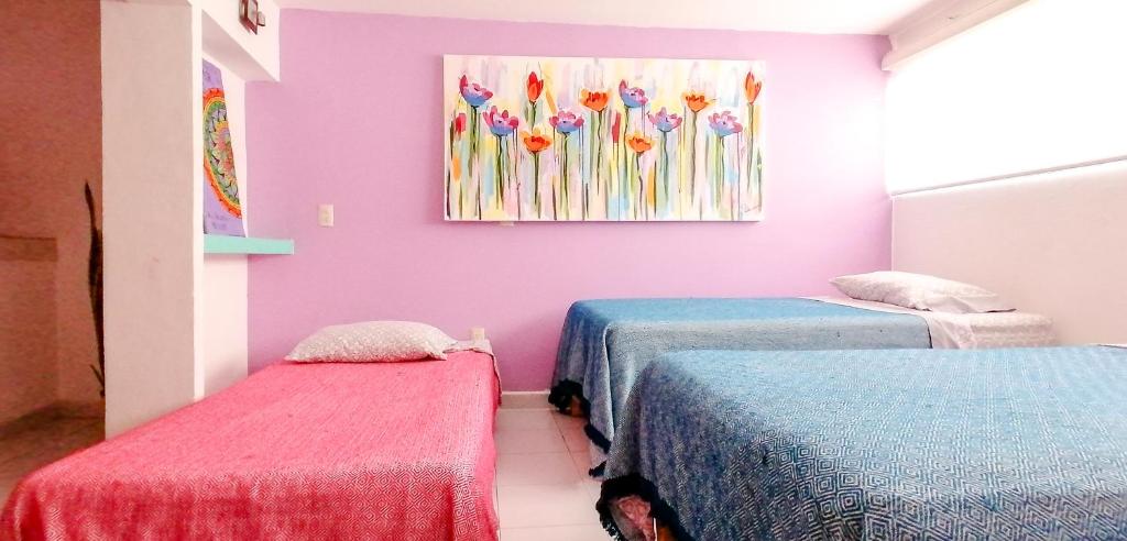 Postel nebo postele na pokoji v ubytování Hostel Vallarta