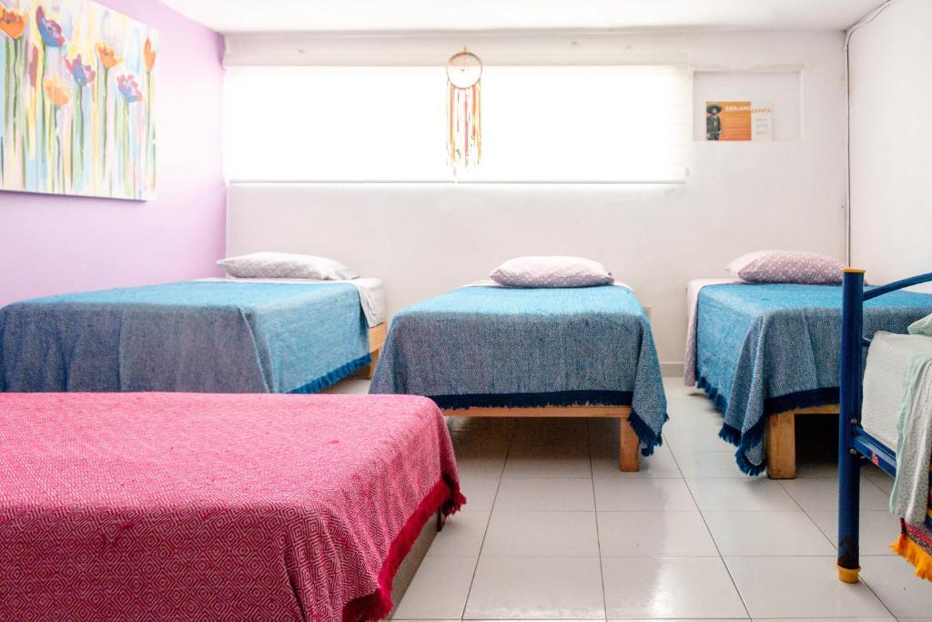 Postel nebo postele na pokoji v ubytování Hostel Vallarta