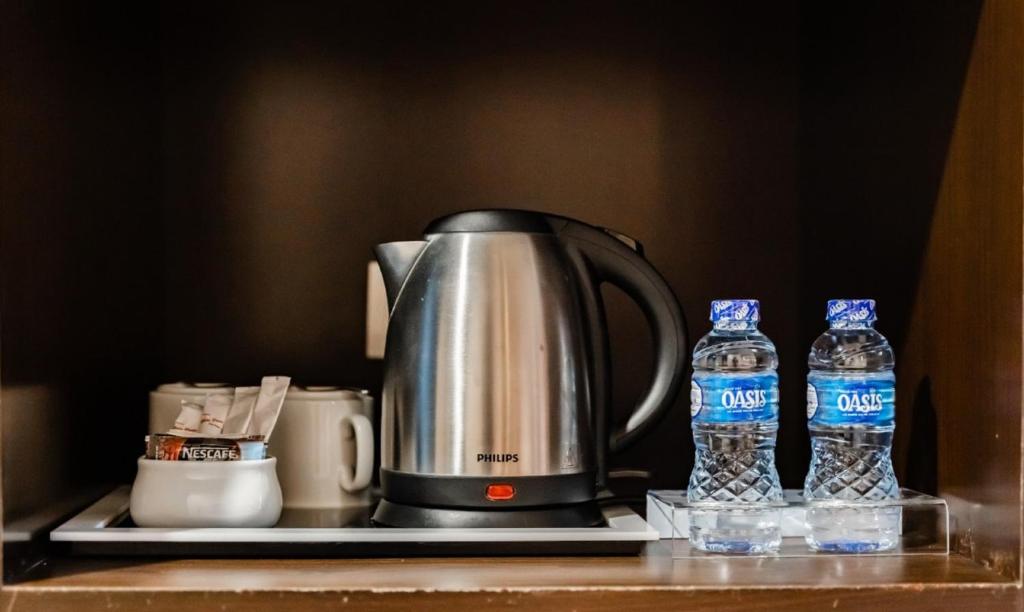 Příslušenství pro přípravu čaje a kávy v ubytování Grand Paragon Hotel