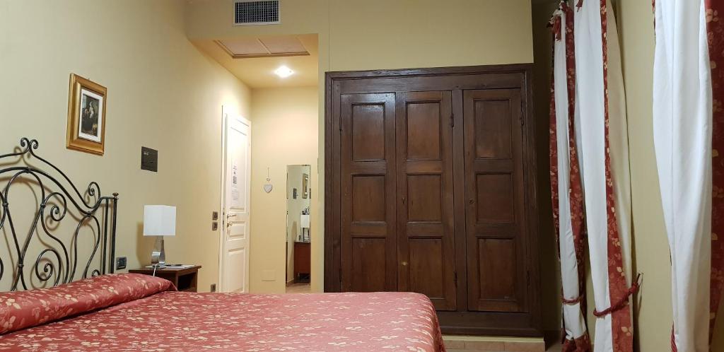 Postel nebo postele na pokoji v ubytování La Regibussa - Hotel Ristorante