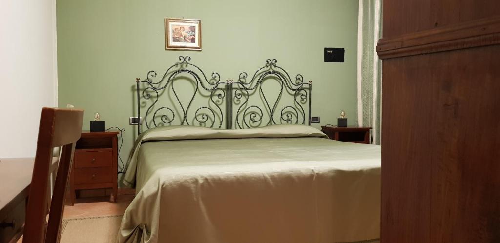 Postel nebo postele na pokoji v ubytování La Regibussa - Hotel Ristorante