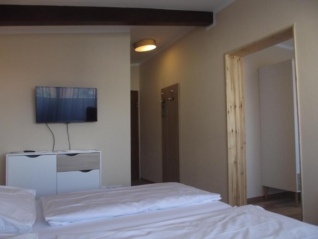 Postel nebo postele na pokoji v ubytování Zum Weissen Lamm