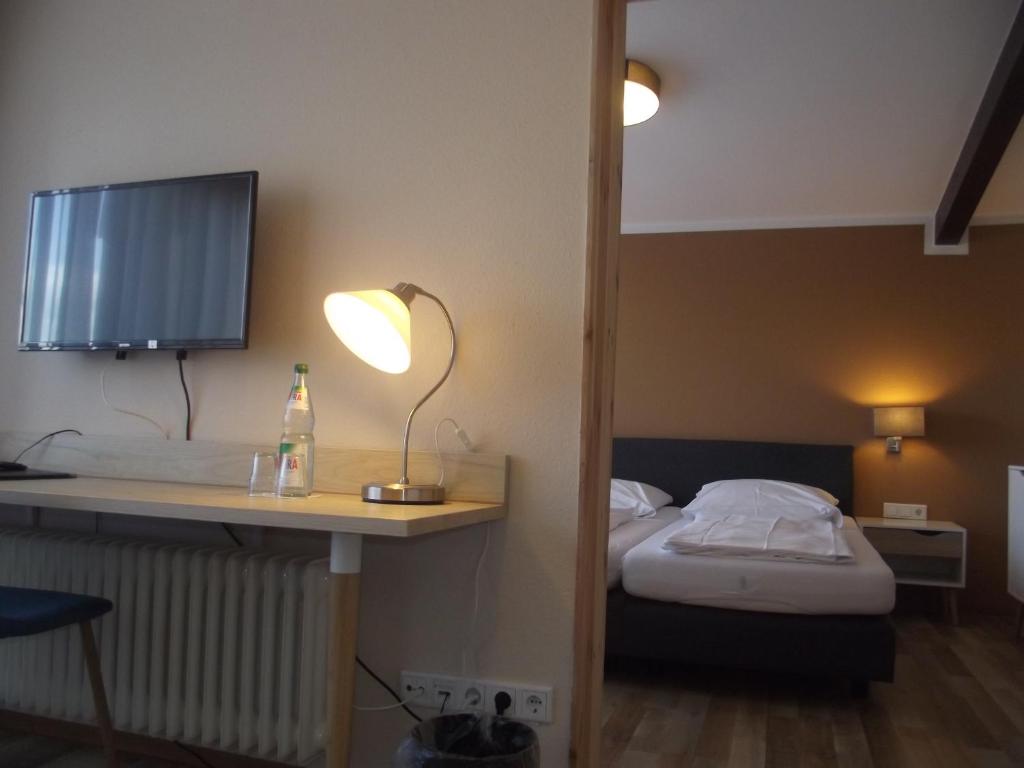 Postel nebo postele na pokoji v ubytování Zum Weissen Lamm