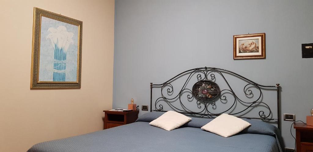Postel nebo postele na pokoji v ubytování La Regibussa - Hotel Ristorante