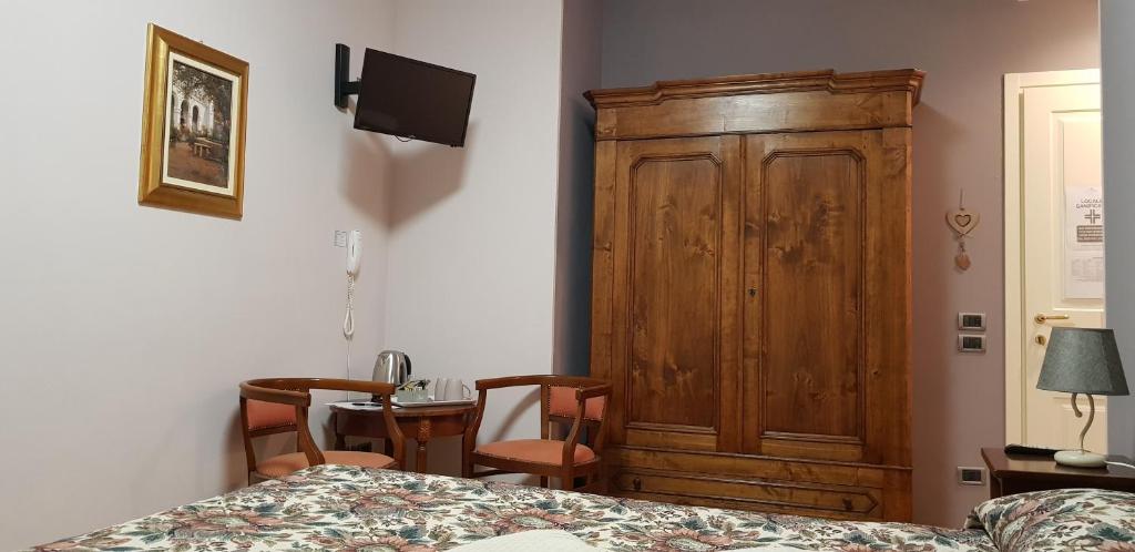 Postel nebo postele na pokoji v ubytování La Regibussa - Hotel Ristorante