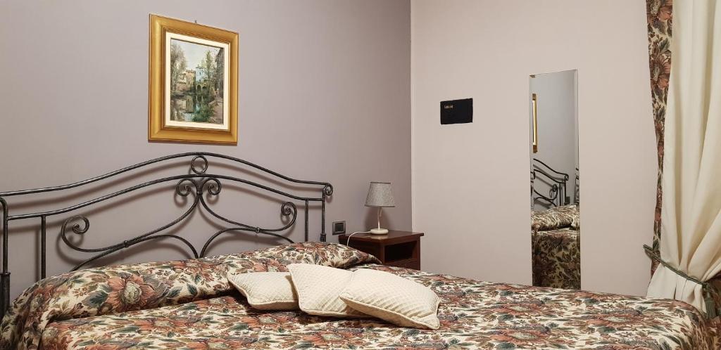 Postel nebo postele na pokoji v ubytování La Regibussa - Hotel Ristorante