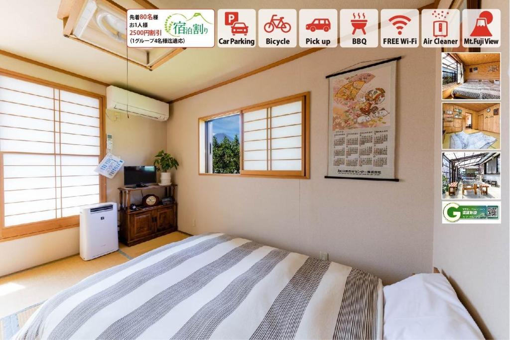 een slaapkamer met een bed in een kamer met ramen bij Asahi - Vacation STAY 84795 in Fujiyoshida