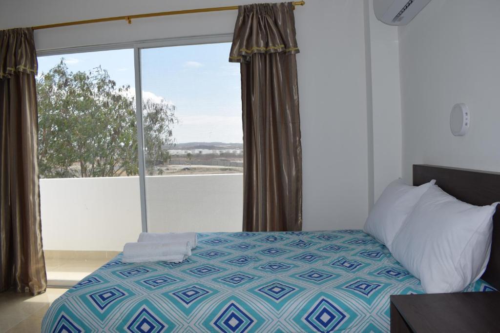Postel nebo postele na pokoji v ubytování Mare S&M Casa Hostal