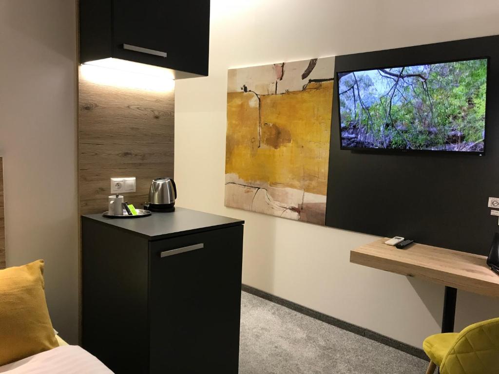 A kitchen or kitchenette at Primma Hotel