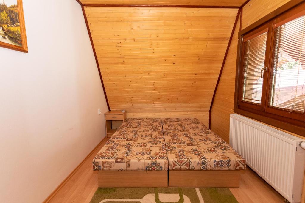 Postel nebo postele na pokoji v ubytování Horsky dom