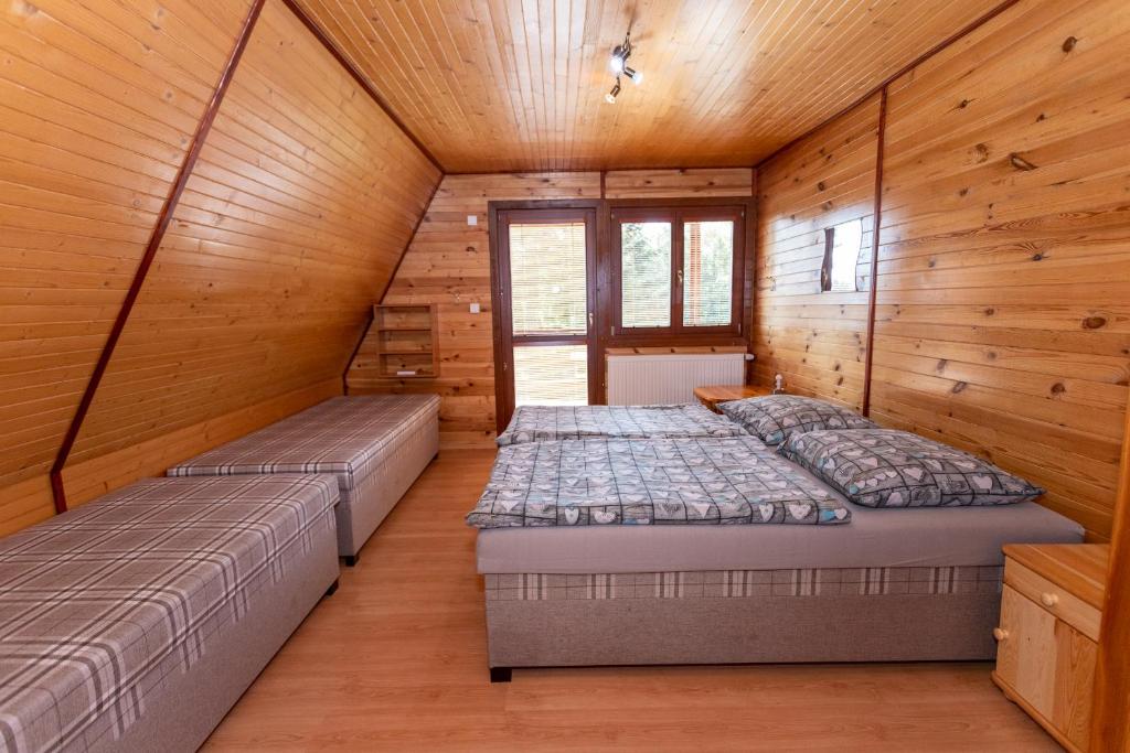 Posteľ alebo postele v izbe v ubytovaní Horsky dom