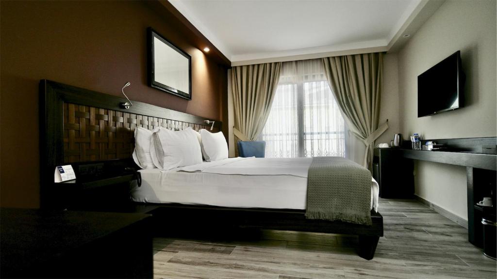 Postel nebo postele na pokoji v ubytování Resa Hotel Göcek